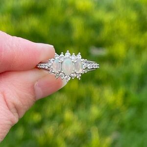 Opal and white zircon halo ring